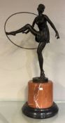 An Art Nouveau style bronze figure of a dancer.