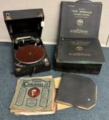 A Colombia No. 201 Picnic gramophone with records.