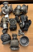 A collection of Antique bicycle lanterns.
