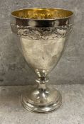 A Victorian silver goblet with chased vine decoration to top. London 1868. By Alfred Ivory.