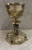 An Impressive 19th Century silver gilt chalice embossed with figures. Approx. 876 grams. Est. £