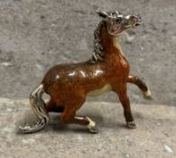 A stylish silver and enamelled figure of a horse. Appro