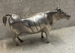 An Edwardian silver cow creamer. London 1909. By John F