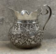 A 19th century Indian Kutch silver jug. Circa 1900. App