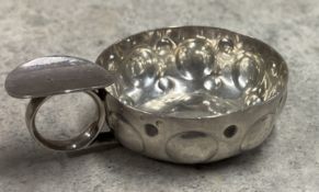 A 19th Century French silver wine taster. Marked to handle. Approx.37 grams. Est. £80 - £120.