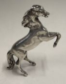 A silver figure of a horse bearing import marks. Approx. 52 grams. Est. £120 - £150.