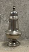 A Victorian silver caster with screw top cover. Sheffield 1887. By Thomas Bradbury. Approx. 26
