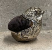 CHESTER: A large pin cushion in the form of a chick. Approx. 241 grams gross weight. Est. £50 - £80.