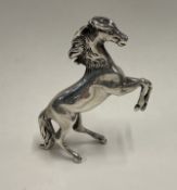 A silver figure of a horse bearing import marks. Approx. 51 grams. Est. £120 - £150.
