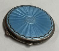 A silver plated blue enamelled compact. Marked to interior. Est. £30 - £50.