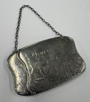 An Aesthetic Movement American silver card case on suspension chain. Approx. 80 grams. Est. £