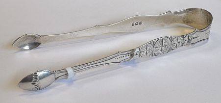 A pair of George III silver sugar tongs with engraved decoration. London 1799. By Peter & Ann