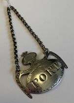A silver wine label for 'Port' with vacant cartouche. London. By Thomas Phipps & Edward Robinson.