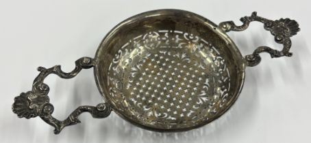 An 18th Century George III silver lemon strainer, fully marked to side. Approx. 81 grams. Est. £