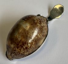 An unusual Antique silver caddy spoon with reeded handle to shell bowl. Approx. 16 grams. Est. £40 -