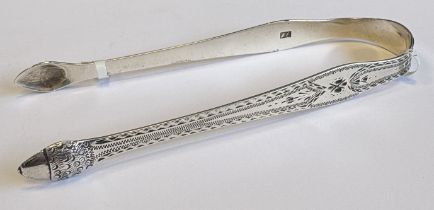 HESTER BATEMAN: A pair of silver sugar tongs with engraved decoration. London. Approx. 31 grams.