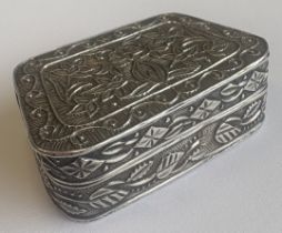 A good quality Continental silver pill box of tapering form with lift-off cover decorated with