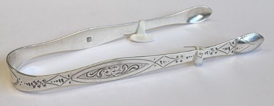 A pair of George III silver sugar tongs with engraved decoration. London 1799. By Peter, Ann &