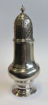 A silver sugar caster with pull-off cover. London 1762. By Robert Peaston. Approx. 75 grams. Est. £