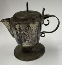 A rare 17th/18th Century Continental silver communion jug. Approx. 80 grams. Est. £200 - £300.