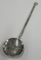 An Antique Continental silver toy spoon with pierced bowl. Approx. 6 grams. Est. £30 - £40.