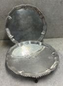 A clean pair of 18th Century silver salvers with central armorials. London 1766. By Ebenezer