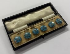 A set of six silver and blue enamelled buttons contained within original box. Approx. 38 grams. Est.