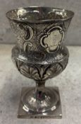A George III silver goblet with embossed decoration. London 1790. By Thomas James. Approx. 208