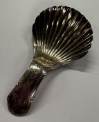 A silver caddy spoon with bright-cut decoration. Birmingham, circa 1810. Approx. 6 grams. Est. £50 -