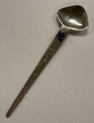 GLASGOW: A novelty Scottish silver spoon with blue stone decoration. By LY & Co. Approx. 9 grams.