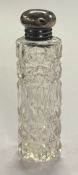 A silver-mounted glass scent bottle. Birmingham. Approx. 23 grams of gross weight. Est. £20 - £30.