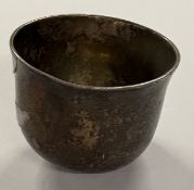 An early Queen Anne silver toy tumbler, marked to base. Approx. 18 grams. Est. £300 - £400.