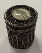 An 18th Century English filigree silver box with lift-off cover. Approx. 18 grams. Est. £300 - £400.