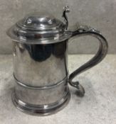A fine quality early 18th Century Queen Anne silver lidded tankard. London 1700. Approx. 765