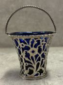 An 18th Century George III silver swing-handled basket with pierced decoration and removable BGL,