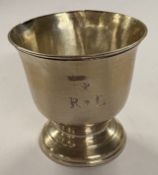 An 18th Century George I silver toy beaker. London 1718. Approx. 27 grams. Est. £400 - £600.