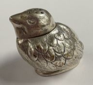 A heavy silver pepper in the form of a chick with textured body, bearing import marks. Approx. 30