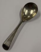 A large Georgian silver caddy spoon. London 1817. Approx. 18 grams. Est. £40 - £60.