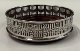 A pierced silver-mounted wine coaster with swag decoration. Sheffield 2004. By James Dixon & Sons