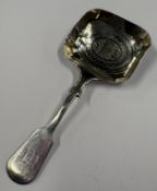 A George III silver caddy spoon with bright-cut decoration to bowl. Birmingham 1812. Approx. 9