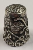 An American Sterling silver thimble with chased decoration, marked 925. Approx. 4 grams. Est. £