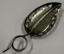 A leaf-shaped silver caddy spoon with pierced decoration in the Georgian style. Birmingham 1901.