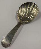 A George III silver caddy spoon with fluted decoration. London 1798. Approx. 5 grams. Est. £40 - £