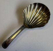 A silver caddy spoon with fluted bowl. London. Approx. 8 grams. Est. £20 - £30.