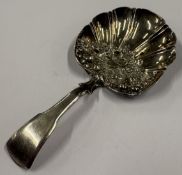 A George III silver caddy spoon with chased decoration. Birmingham 1813. By Samuel Pemberton.