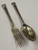 A silver and enamelled fork and spoon set depicting the nursery rhyme 'Humpty Dumpty'. Birmingham