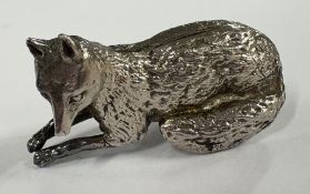 A silver figure of a fox. Approx. 11 grams. Est. £30 - £40.