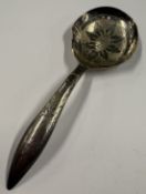 A silver caddy spoon with bright-cut decoration, marked to reverse. Birmingham 1813. By WP.