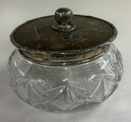 A large silver and tortoiseshell-lidded glass dressing table jar with swag decoration. Est. £30 - £