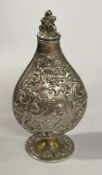 An Antique silver flask chased with putti cherub decoration. Approx. 48 grams. Est. £120 - £150.